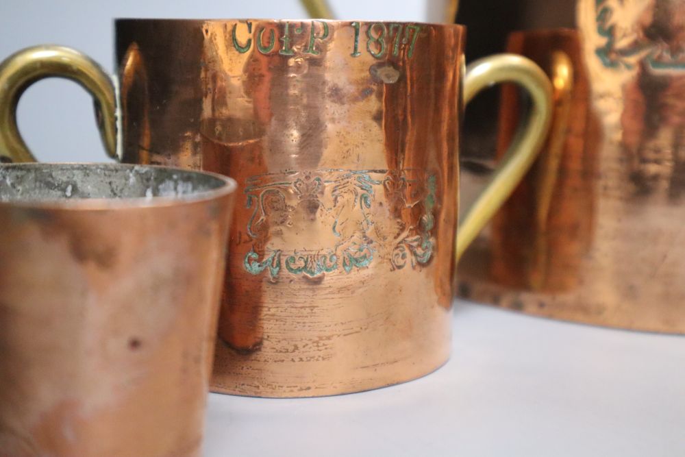Five 19th century graduated copper measures, tallest 17cm